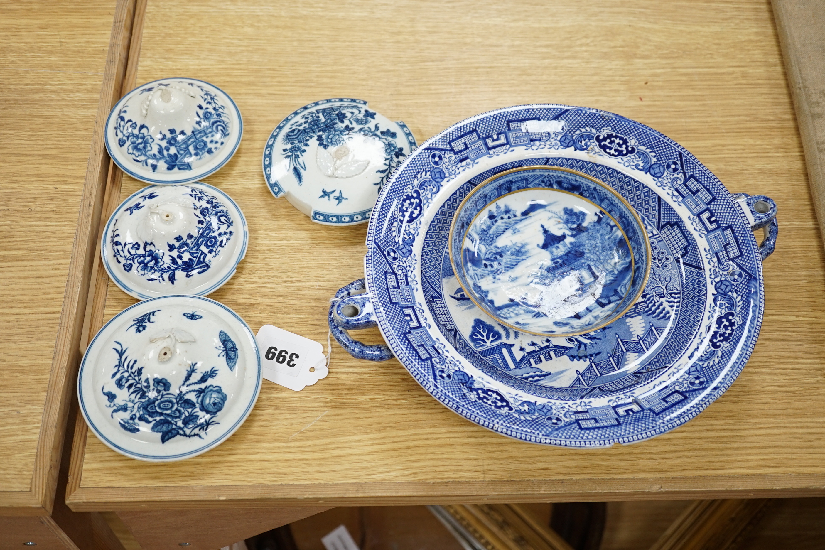 A 19th century Abbotsford pattern blue and white tureen and cover, various dishes and a collection of early Worcester tea and coffee pot covers